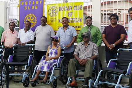 Robby Saywack (third left) and Rajendra Rajkumar (fourth left) and members of the Board of Directors of the RCNA posing with the two recipients 