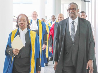 Justice Desiree Bernard (left) making her way into a special sitting of the Caribbean Court of Justice (CCJ) held yesterday to mark her retirement. Justice Bernard was appointed to the CCJ in 2005 and was the first woman to join the court.  In this Arian Browne photo, Justice Bernard walks besides Chief Justice of Belize Kenneth Benjamin.
