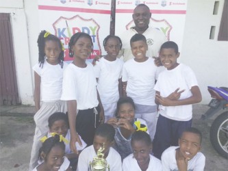 South Ruimveldt Primary School cricketers and their teacher Royden Profitt 