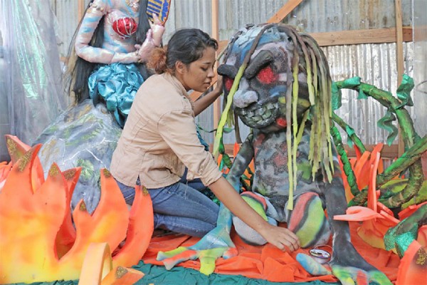 Baccoo? An art student putting finishing touches to a creature from Guyanese folklore at the Burrowes School of Art yesterday. The floats and costumes designed by Burrowes students and faculty are for the Ministry of Culture Mash Band.  The theme for Mashramani this year is ‘Cultural Folklore; Celebrating 44’. (Photo by Arian Browne) 