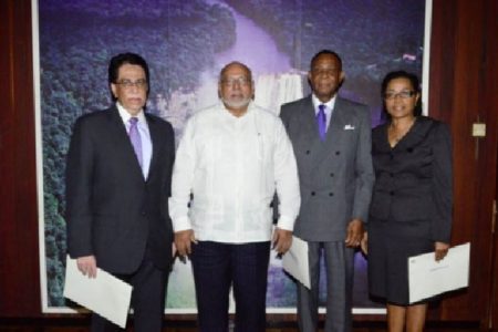 President Donald Ramotar (second from left) and newly sworn-in commissioners, Senior Counsel Seenath Jairam (left), Queen’s Counsel, Sir Richard Cheltenham (third from left) and Queen’s Counsel, Jacqueline Samuels-Brown. (GINA photo)