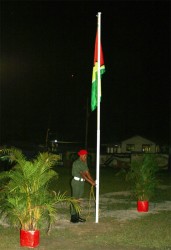 A rank of the Guyana Defence Force raising the Golden Arrowhead 