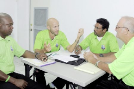 Umpires workshop: From left, Nigel Duguid, Christopher Taylor, Zahid Bassarath and Goaland Greaves in discussion. Three WICB workshops commenced in Jamaica this week for umpires, match referees and video analysts from across the region. (WICB photo)