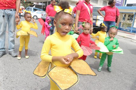 Pretty little flowers: Tender Heart Day Care and Play Group of Parade Street, Kingston had a floral theme during a mini Mash parade today (Photo by Arian Browne)