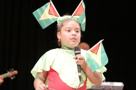 Keziah Jarive of Arapaima Primary, Region Nine performing `Leh we celebrate Mash’ in the calypso category of the children’s Mash contest at the National Cultural Centre yesterday.
