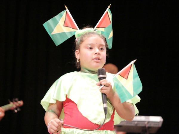 Keziah Jarive of Arapaima Primary, Region Nine performing `Leh we celebrate Mash’ in the calypso category of the children’s Mash contest at the National Cultural Centre yesterday. 