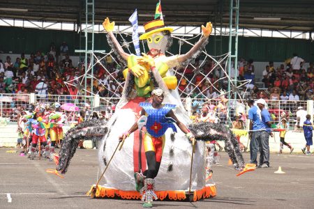 Region Ten’s ‘King Witty’ performs on the National Park tarmac during the Children Costume Parade on Saturday, sponsored by GT&T. (Photo by Arian Browne)