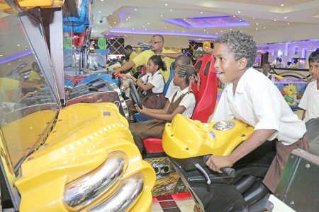 These pupils of the Kuru Kururu Primary School are seen having a whale of a time last week during their visit to the Princess Hotel’s Fun City Arcade which they accessed for free as part of an initiative of the hotel.