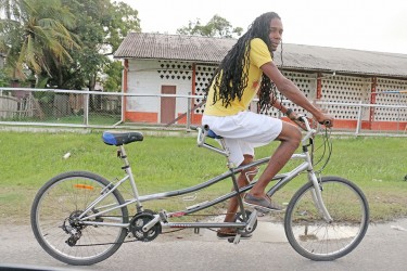 Cruising down Front Road, West Ruimveldt on a tandem bike.