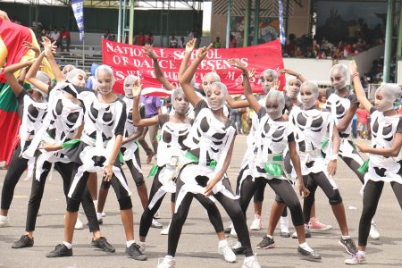 The National School of Dance students, part of the float ‘Is We Time Fuh Mash’ on the National Park tarmac during the Children Costume Parade on Saturday, sponsored by GT&T. (Photo by Arian Browne)