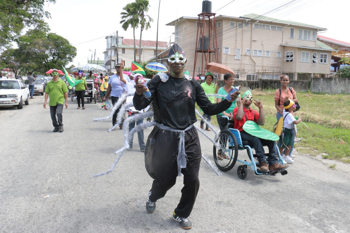 Is it Spiderman? Yes, it’s Anansi!  Ptolemy Reid Rehabilitation Centre group during a mini Mash parade today (Photo by Arian Browne)