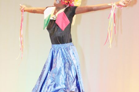 Aliya Moore of North Ruimveldt Primary performing `Mash is we thing’ in the dramatic poetry section of the Children’s Mashramani contest on Monday at the National Cultural Centre.