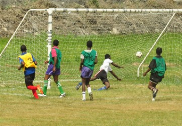 Action in the game between North Ruimveldt and School of the Nations yesterday. (Orlando Charles photo)