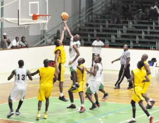 Action in the game between Kings of Linden and Republic Bank Nets Saturday night at the Cliff Anderson Sports Hall. (Orlando Charles photo)