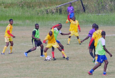 Action in the Petra Organization’s Milo Cup competition yesterday at the Ministry of Education ground, Carifesta Avenue. (Orlando Charles photo)