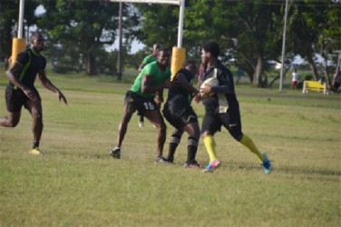 The University of Guyana and the Guyana Defence Force players caught during yesterday’s Bounty Farm Products 15-a-side rugby final at the National Park Playfield.