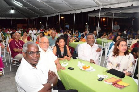President Donald Ramotar (second from left), First Lady Deolatchmee Ramotar (third from left), Prime Minister Samuel Hinds (second from right), Minister of Public Works Robeson Benn (left) and Minister of Foreign Affairs Carolyn Rodrigues-Birkett at the chowtal samelaan yesterday at the  Guyana International Conference Centre hosted by the first couple. (GINA photo)