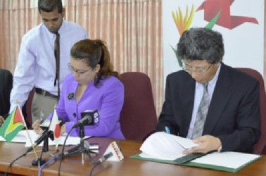 Minister of Foreign Affairs, Carolyn Rodrigues-Birkett signing the US$2.9M agreement with Japanese Ambassador, Yoshimasa Tezuka at the Ministry of Foreign Affairs. (GINA photo) 