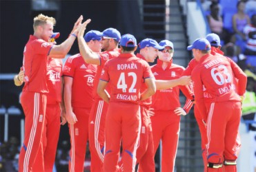 The England team celebrates their 25-run win. (Photo courtesy WICB media) 