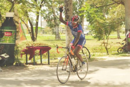 Team United’s Hamzah Eastman about to cross the finish line in the 35-lap event of the Caribbean International Distributors Inc. (CIDI) 11-race cycling programme which was staged at the National Park yesterday. (Orlando Charles photo) 