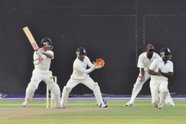 YOUNG TIGER ON THE GO! Guyana’s Tagenarine Chanderpaul, fresh of his  exploits in the ICC U19 World Cup competition cuts through the off side during his 41 yesterday against Barbados at the National Stadium at Providence. (Orlando Charles photo) See story on page 29