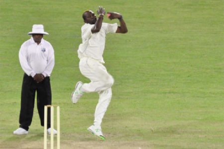 Sulieman Benn takes a simple return catch off Keon Joseph as defending champions Barbados completed a comfortable 136-run win over Guyana at the National Stadium at Providence yesterday. (Orlando Charles photo)