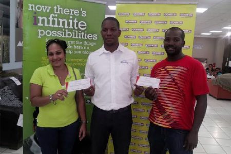 From left are Raemona Urling, Courts Marketing Manager Pernell Cummings and Quaison at Courts, Main Street yesterday.
The promotion which ran from January 21 to February 14 was focused on sharing the love by promoting bedroom ranges at unbelievable prices for customers who purchased any item over $29,999.
Urling and Boodie each won a romantic getaway for two at the Pegasus Hotel.

