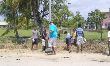 Residents of the community pitching in during the clean-up exercise