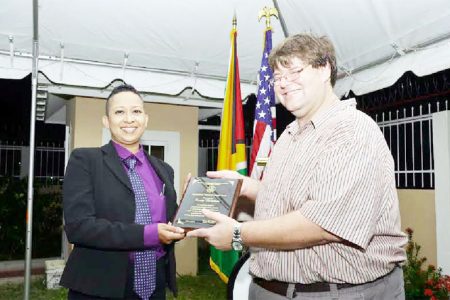 In recognition of her exceptional courage and leadership in advocating for women’s rights and empowerment and raising public awareness to protect the human rights of Lesbian, Gay, Bisexual and Transgender persons, Human Rights activist Zenita Nicholson was last evening honoured by the United States Embassy. In photo Nicholson receives the award from Chargé d’ Affaires Bryan Hunt. 