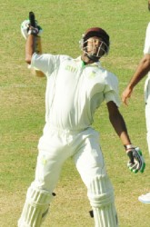 Sunil Ambris celebrating his debut century against Guyana yesterday 