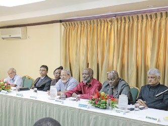 From right are Gecom Chairman, Dr Steve Surujbally; new Chief Election Officer, Keith Lowenfield and Gecom commissioners Vincent Alexander,    Mohamood Shaw, Sandra Jones,  Athmaram Mangar and Dr Keshav Mangal. 