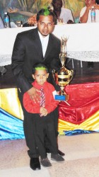 Pooran Seeraj and his son after he collected his winning trophy 