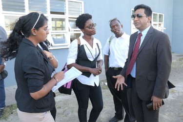 Students steal a few additional minutes with Minister Anil Nandlall after the meeting