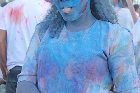 Feeling blue… A Phagwah reveller at Inspire Inc’s activity at the Guyana National Stadium, Providence yesterday. (Photo by Arian Browne)