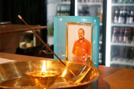 A photo of Peter Pitamber in a tribute on the bar of Calypso Hut, the restaurant he ran for over 20 years. (Brampton Guardian photo)