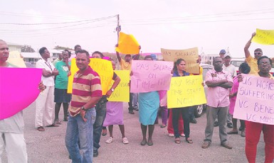 UG staff demonstrating against the non-payment of their benefits and tax and insurance contributions yesterday on the Turkeyen Campus.  