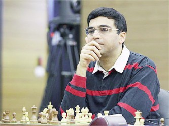 Vishy Anand gives an imperceptible smile, as he breaks the Armenian grandmaster Levon Aronian and the bookies in round one of the Candidates chess tournament. 