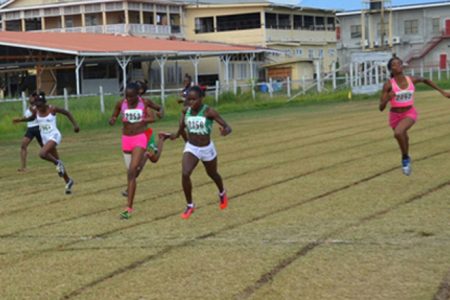Jevina Sampson about the cross the finish line ahead of Avon Samuels in the 200m under-18 Girls event.

