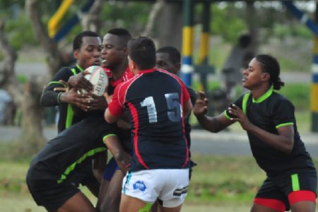 Action at the rugby field involving the UG Wolves and the Pepsi Hornets yesterday. (Orlando Charles photo)