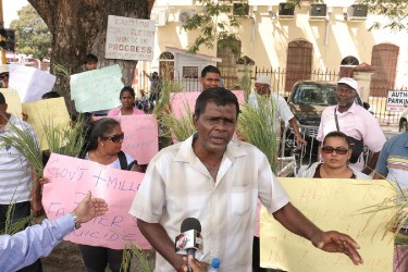 Essequibo rice farmers protest: Tage ‘Sona’ Shewcharan told Stabroek News that he was owed over $500,000 by numerous millers. He said that while he received payment last week many of his fellow farmers received post-dated cheques instead. 24-3-14 BUDGET READING AND RICE FARMERS IMG_0336 Rice farmers have proposed that a possible fund be established so millers can readily access payments in accordance with the Factory Acts. Also farmers considered proposals by the opposition to establish crop insurance. Leader of the opposition David Granger addressed farmer’s concerns. 