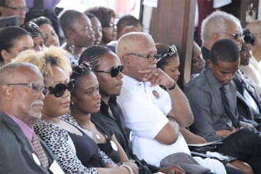 Family members of the late Deborah Backer at her funeral.  