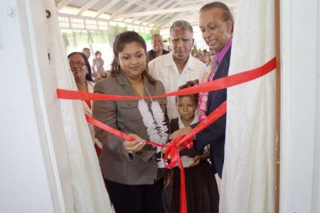 Minister of Education Priya Manickchand (left) and Trevor Anthony Subryan cutting the ribbon (Ministry of Education photo)
