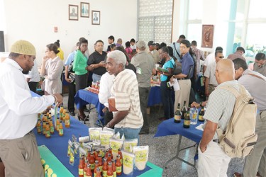  Persons viewing the display stalls of various agro-processing enterprises