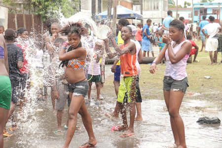 Water galore: A water-drenched scene in Albouystown on Monday.