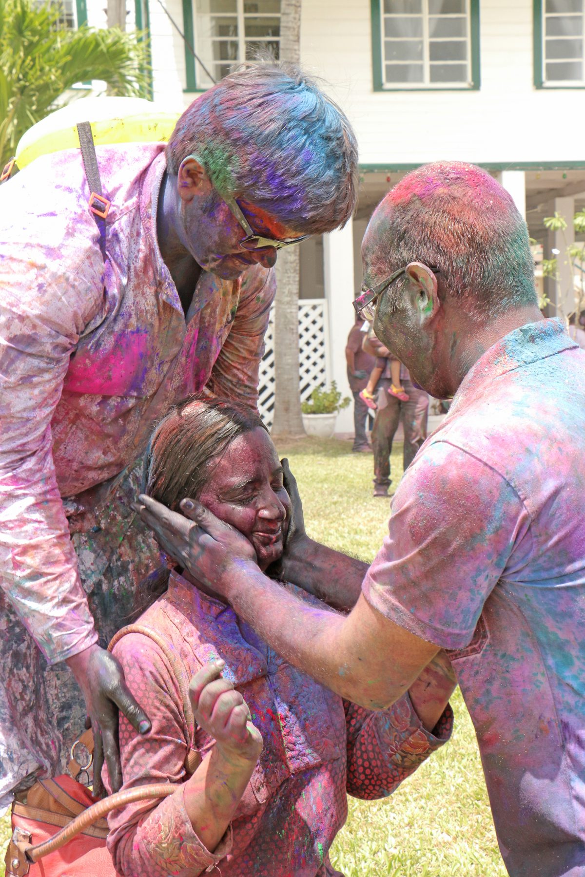 Coloured: This woman having her face powdered during Phagwah festivities at the Indian Cultural Centre today.