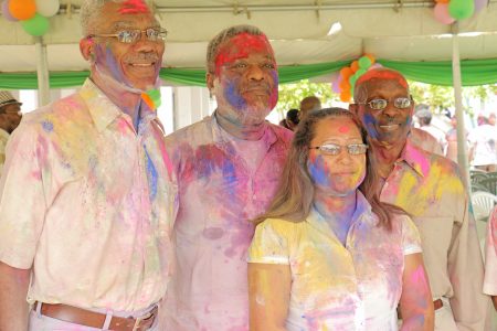 From left: Opposition Leader David Granger, Prime Minister Sam Hinds, Amerindian Affairs Minister Pauline Sukhai and Mayor Hamilton Green enjoying Phagwah festivities at the Indian Cultural Centre today.