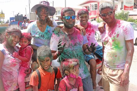 Coloured and happy:  This family on Station Street on Monday exuded the phagwah spirit.
