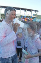Face full of powder: This girl grimaces as she gets a cloud of powder right in the face on Monday at Inspire Inc’s activity at the Guyana National Stadium, Providence. (Photo by Arian Browne)