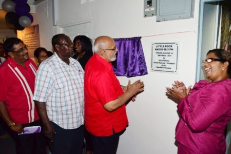 From left: Region Six Chairman David Armogan, Rockcliff Christie, President Donald Ramotar and Pearl Christie unveiling a plaque yesterday commemorating the launch of Little Rock Radio 88.5FM in New Amsterdam, Berbice. (GINA photo)