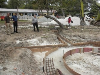 Minister of Natural Resources and the Environment Robert Persaud (second from left) yesterday inspecting progress on the construction of the Petting Zoo at the Botanical Gardens. (Ministry of Natural Resources photo)